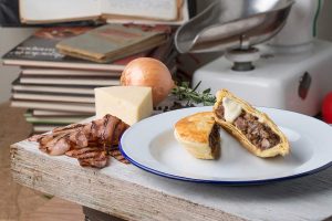 Classic Steak, Bacon and Cheese Pie on a plate